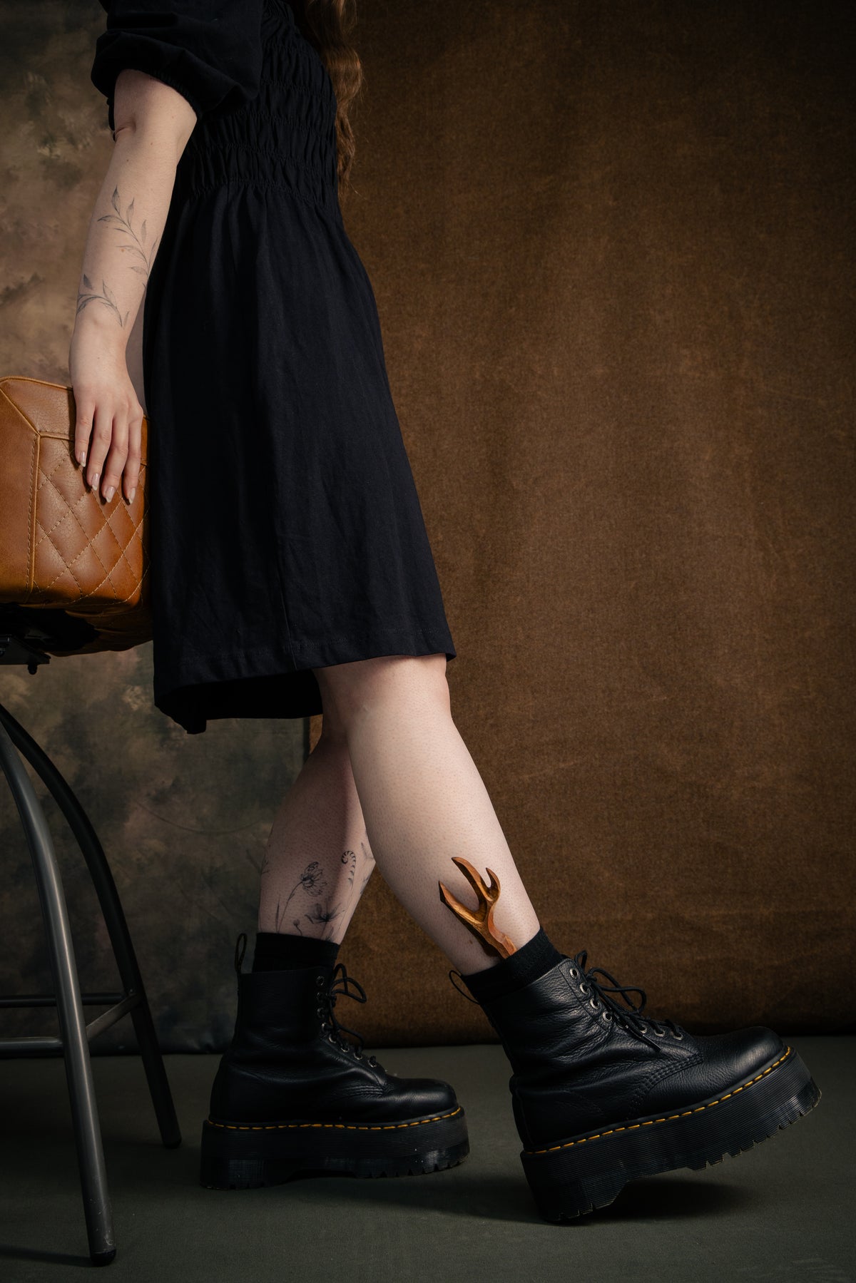 Sycamore Sgian Dubh worn tucked into the sock with black Doc Marten boots and a black dress.